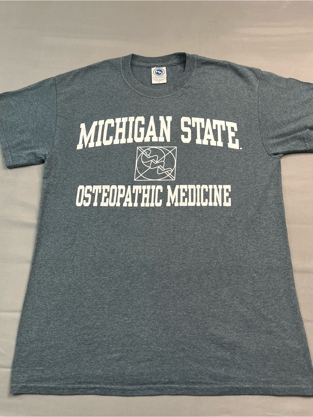 Agenda Heather Charcoal Gray Michigan State Osteopathic Medicine Graphic Tee